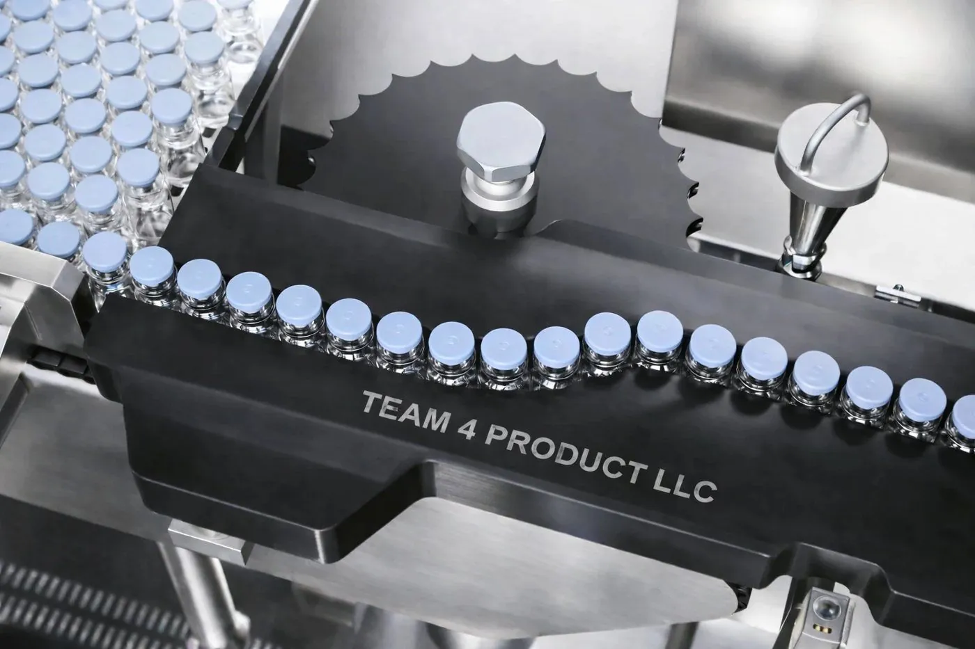 Sterile vials with blue flip-off seals on a Team 4 turntable